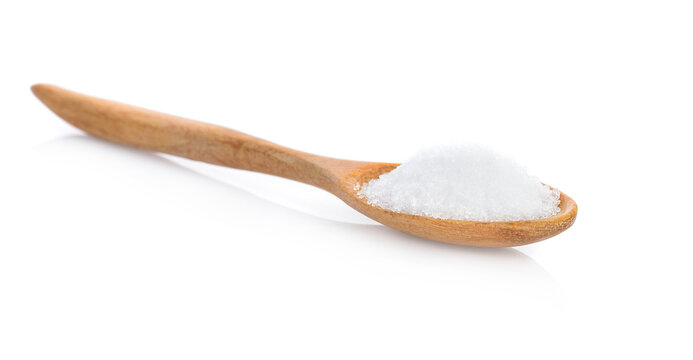 Sugar in a wooden spoon isolated on white background