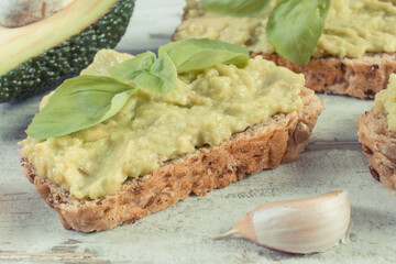Sandwiches with paste of avocado. Healthy food as source omega acids, vitamins and minerals