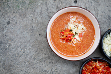 Sukiyaki dip sauce with chopped garlic and chopped red chilli