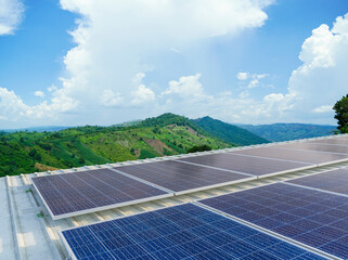 solar cells panel installed on the roof of a large building are full of dirt and dust.