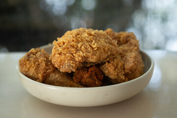 Crispy fresh fried chicken on a white plate