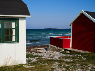 Beautiful cute little wooden beach huts summer houses, painted in lively colors, Aero Island, South Funen, Denmark