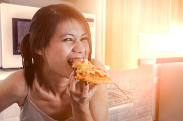 Happy woman eating tasty pizza.