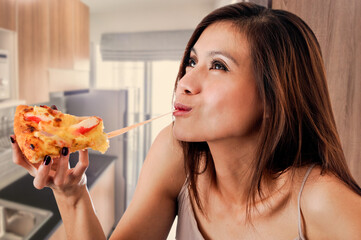 Happy woman eating tasty pizza.