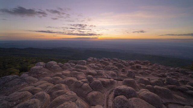 Time lapse of dry rock stones in Lan Hin Pum, Phu Hin Rong Kla National Park, Phitsanulok, Thailand. Mountains hill view with the park landscape. Tourist attraction and sunset skyline.