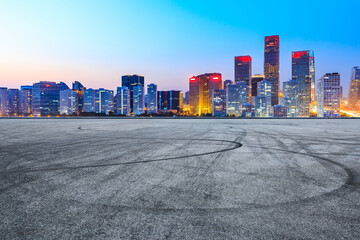 Asphalt road ground and modern city commercial buildings in Beijing at night,China.