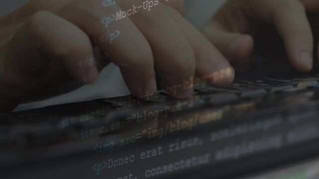4K Video close up hand typing keyboard overlay with coding text screen . Concept for coding and programming and html text.