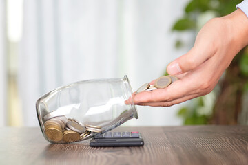 Put euro coins into a glass bottle