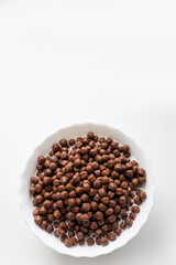 Breakfast cereals, cornflakes, chocolate in milk cups, healthy breakfast