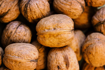 Large walnuts in shell together.