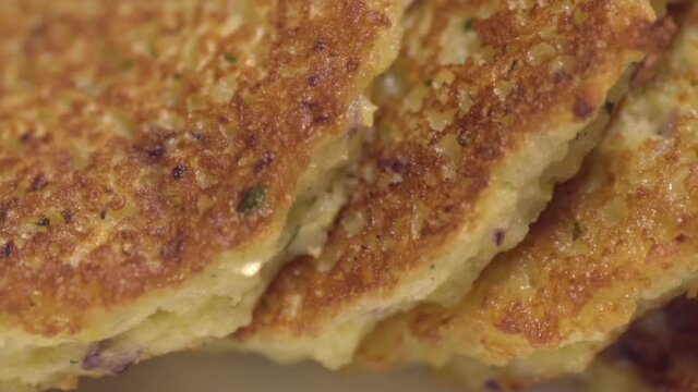 Ready potato pancakes are on the plate. Close-up. Dranik, Russian traditional food