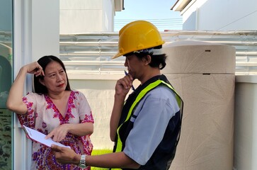  Architect and women are viewing documents.