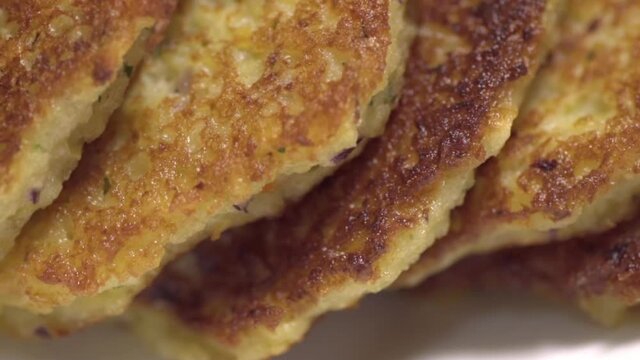 Ready potato pancakes are on the plate. Close-up. Dranik, Russian traditional food. Side view