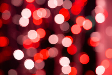 Abstract red bokeh texture on black background