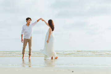 romantic time loving couple dance on the beach. Love travel concept. Honeymoon concept.