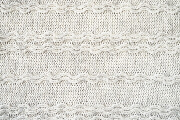 The texture of the woollen product. Grey background. High quality