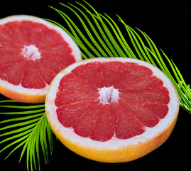 grapefruit lies on a black background