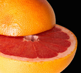 grapefruit lies on a black background