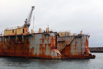 Fototapeta na wymiar Old rusty floating dry dock fragment, Iceland