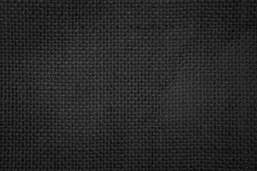 Jute hessian sackcloth canvas woven texture pattern background in light black color blank empty.