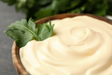 Bowl with mayonnaise sauce and parsley, close up