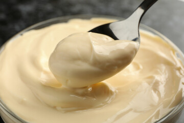Bowl and spoon with mayonnaise, close up - obrazy, fototapety, plakaty