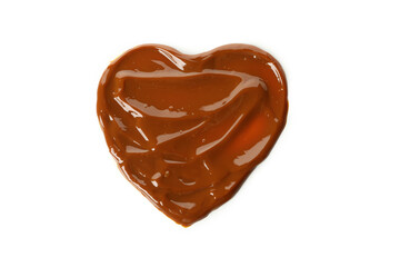 Heart made of caramel condensed milk isolated on white background