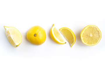 Isolated lemons. Collection of whole and sliced lemons isolated on white background
