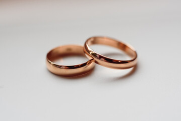 two traditional wedding gold engagement rings close-up