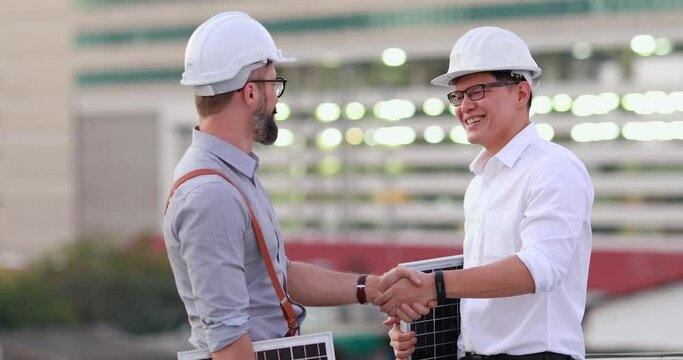 Electrical Engineer Technician and CEO executive business people making handshake after meeting. clean and green alternative energy concept.