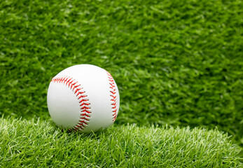 Baseball is on green grass