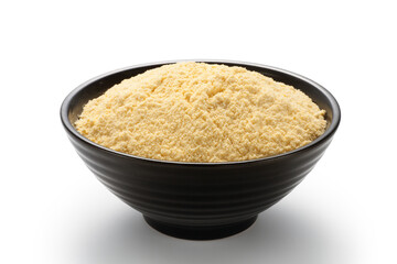 Corn flour in a black bowl isolated on white background