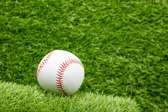  Baseball is on green grass background