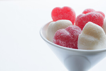 Obraz na płótnie Canvas Heart Shaped Raspberry Gummies, Candies on White Background. Valentine's day image.