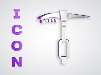 Paper cut Ice axe icon isolated on grey background. Montain climbing equipment. Paper art style. Vector.