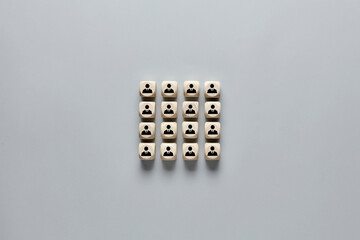 Wooden cubes with employee icons. Concept of recruitment, hiring, team building.