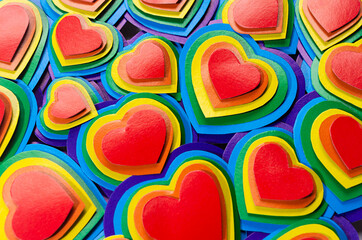 Lgbt Valentine's day background - rainbow hearts pattern, top view, closeup.