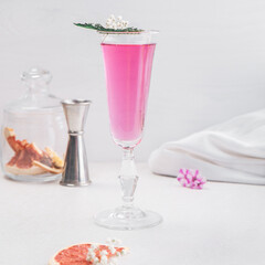 Purple cocktail drink in a glass