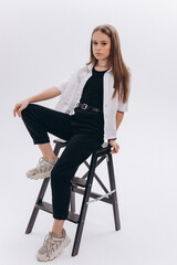 Fototapeta premium Pretty beauty young girl model posing on white background in studio. Caucasian 