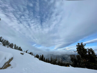 Landscape view of the slopes at a ski resort on a cloudy winter day