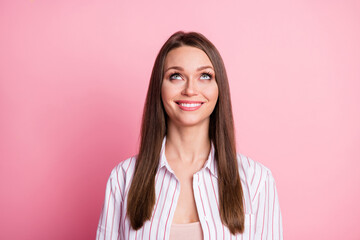 Fototapeta premium Portrait of young attractive cheerful dreamy girl woman look up think imagine isolated on pink color background