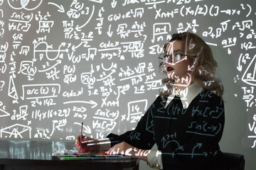 Intelligent young female maths student or teacher wearing glasses standing in front of a chalkboard with mathematical equations