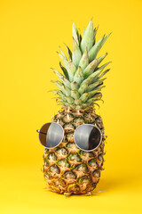 Pineapple with glasses summer on yellow background © Exploder