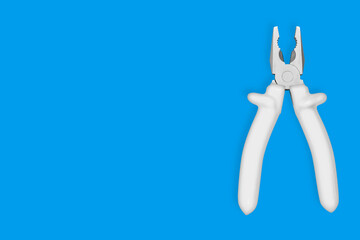 Metal pliers with rubber grips Background on the theme of tools, repair or maintenance of equipment.