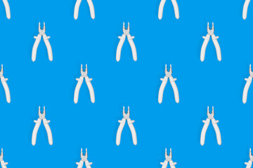 Pliers seamless pattern. Metal pliers with rubber grips.