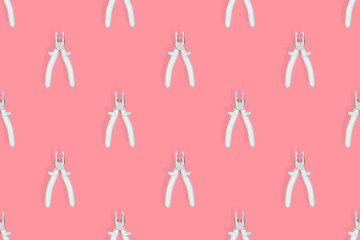 Pliers seamless pattern. Metal pliers with rubber grips.