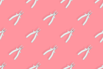 Pliers seamless pattern. Metal pliers with rubber grips.