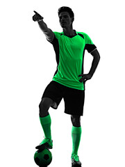 one young caucasian soccer player silhouette shadow in studio isolated on white background