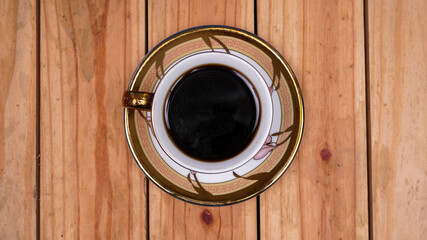 black coffee at cup on top wood table