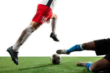 Close up legs of professional soccer, football players fighting for ball on field isolated on white background. Concept of action, motion, high tensioned emotion during game. Cropped image.